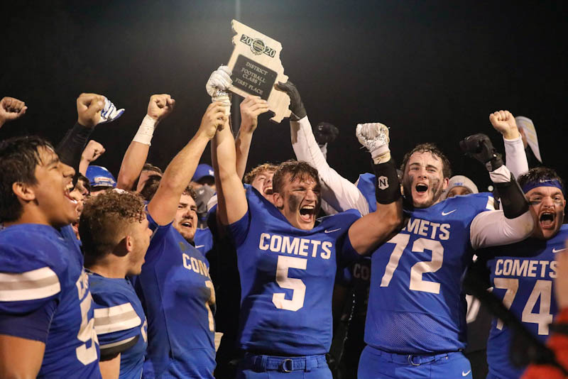 The Marionville High School football team celebrates winning its first District title since 2014 after defeating Lockwood on Friday, November 13, 2020, in Marionville, Missouri.