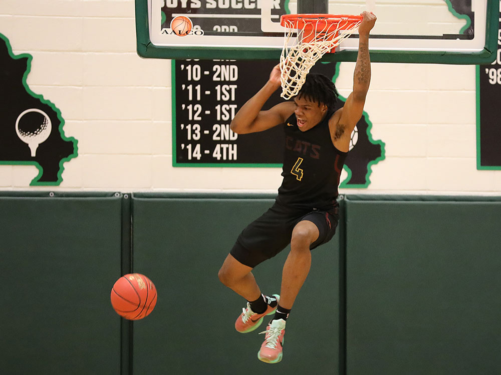 Jonathan Dunn of Logan-Rogersville dunks during a basketball game against Springfield Catholic on February 3, 2021, in Springfield, Missouri.