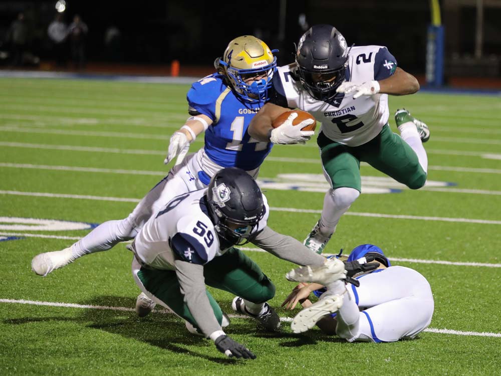 Players from Harrison and Little Rock Christian compete in a Class 5A playoff game on December 4, 2020, in Harrison, Arkansas.