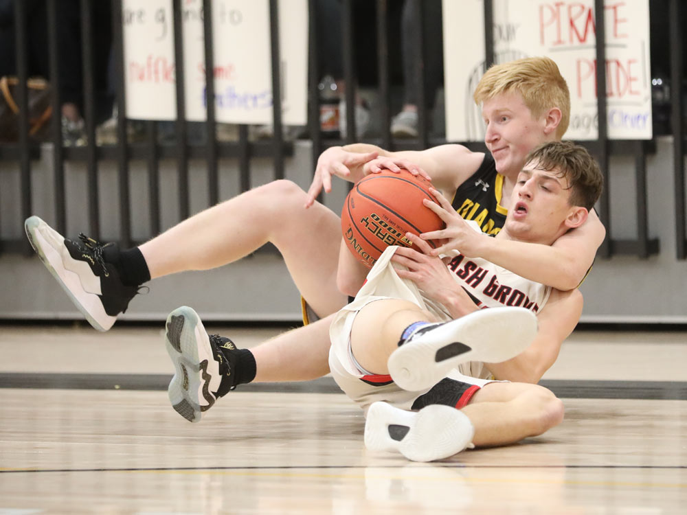 Players from Ash Grove and Diamond compete in a high school basketball game on Saturday, February 26, 2022, in Diamond, Missouri