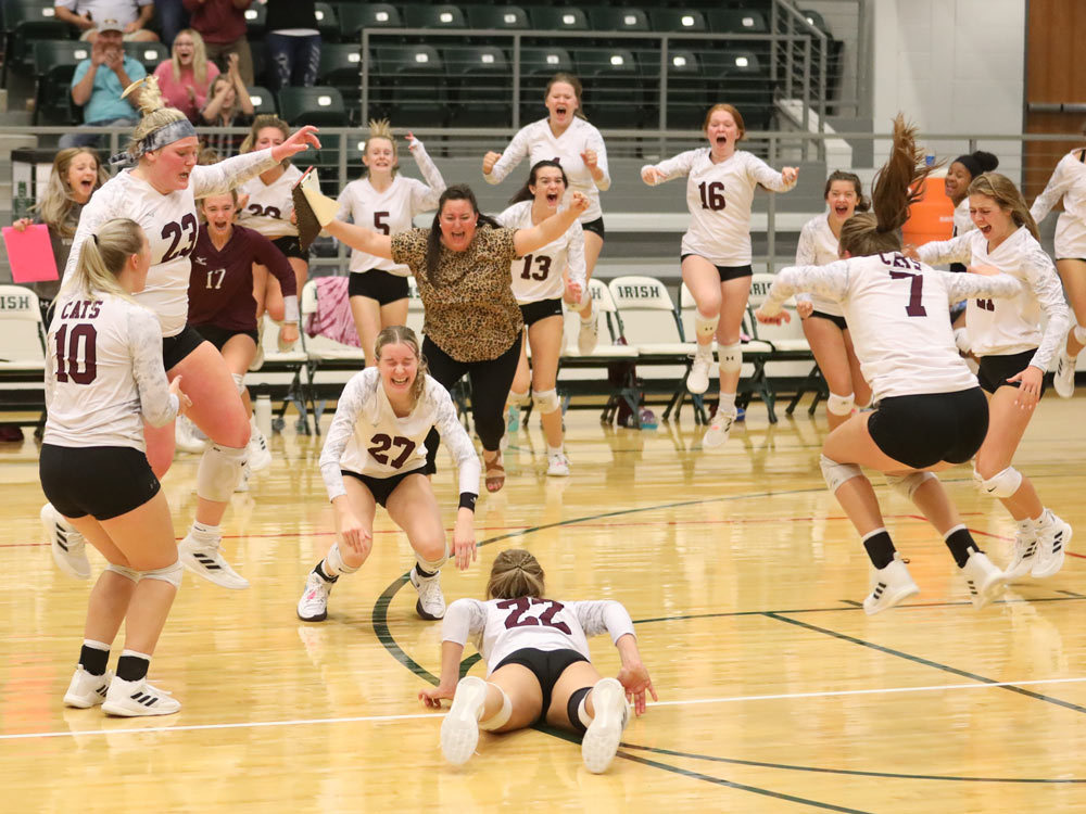Members of the Logan-Rogersville volleyball team celebrate their victory over Springfield Catholic on October 12, 2021 in Rogersville, Missouri.