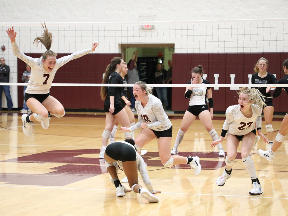 Members of the Logan-Rogersville volleyball team celebrate while competing against Willard on October 26, 2021 in Rogersville, Missouri.