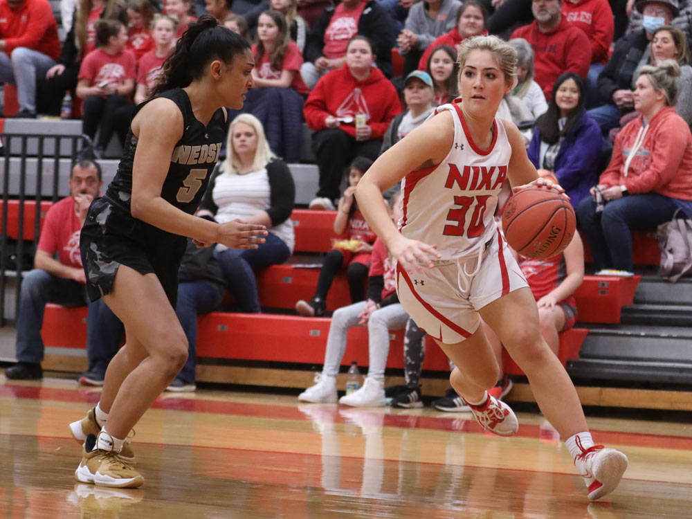 Players from Nixa and Neosho compete in a high school basketball game on February 22, 2022 in Nixa, Missouri.