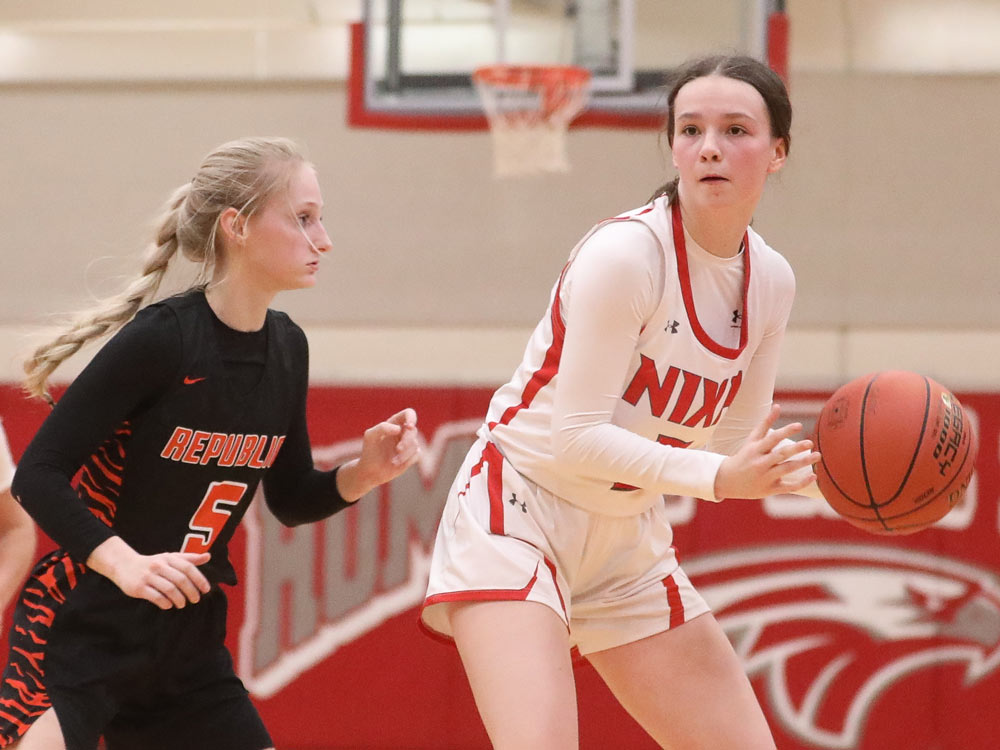 Players from Nixa and Republic compete in a high school basketball game on February 14, 2022 in Nixa, Missouri.