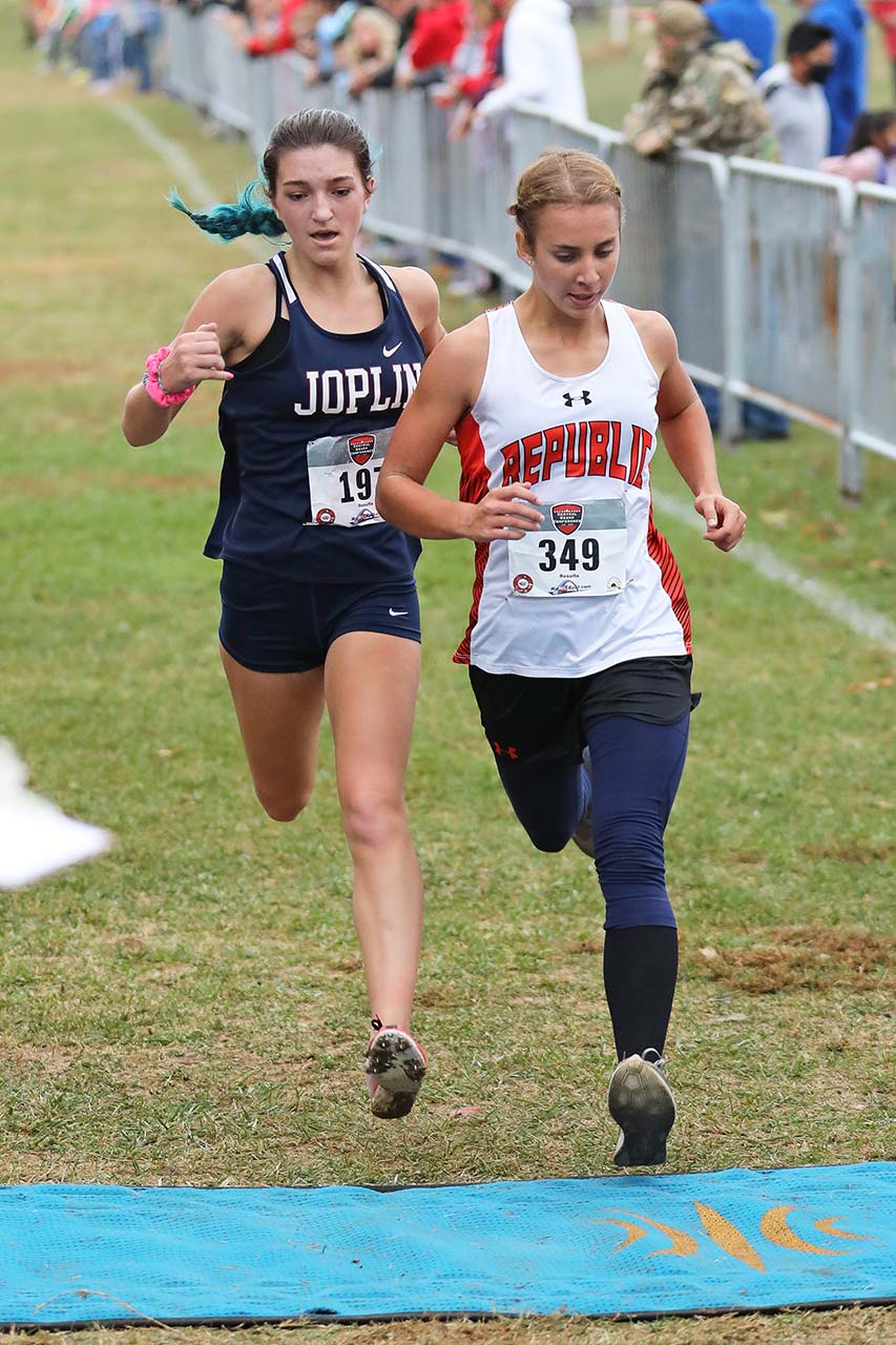 Runners from Joplin and Republic battle for position at the finish line of the Central Ozark Conference cross country championship
